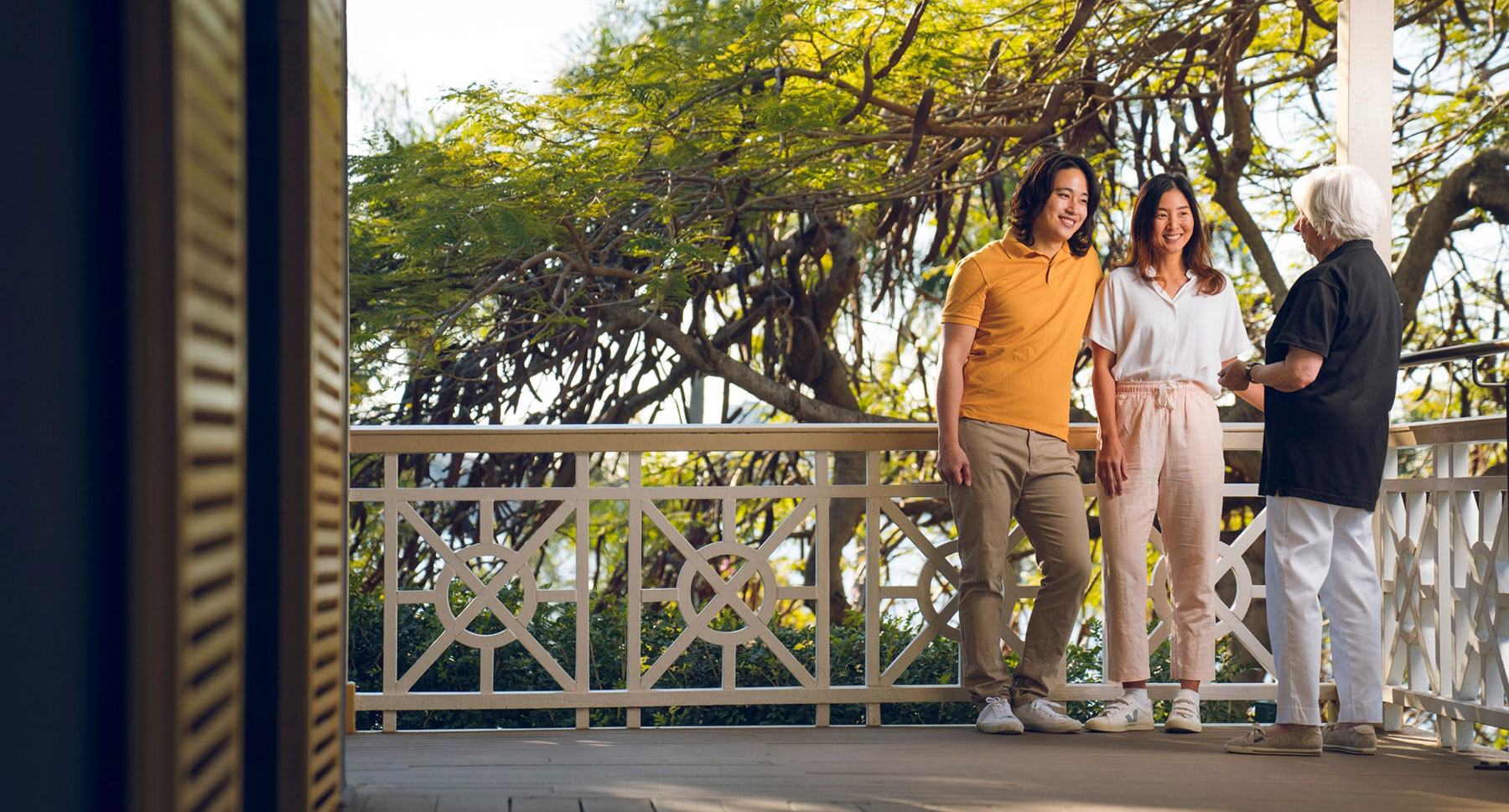 Young couple with a Newstead House guide on the veranda